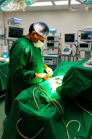 Dr. Anand Saxena performing surgery in the operation theatre